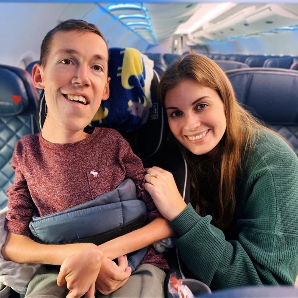 Hannah Aylward and Shane Burcaw on a plane.