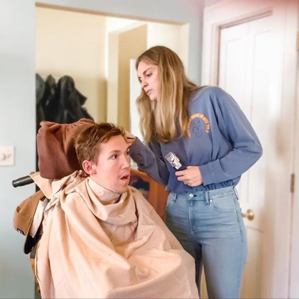 Hannah helps cut Shane's hair.