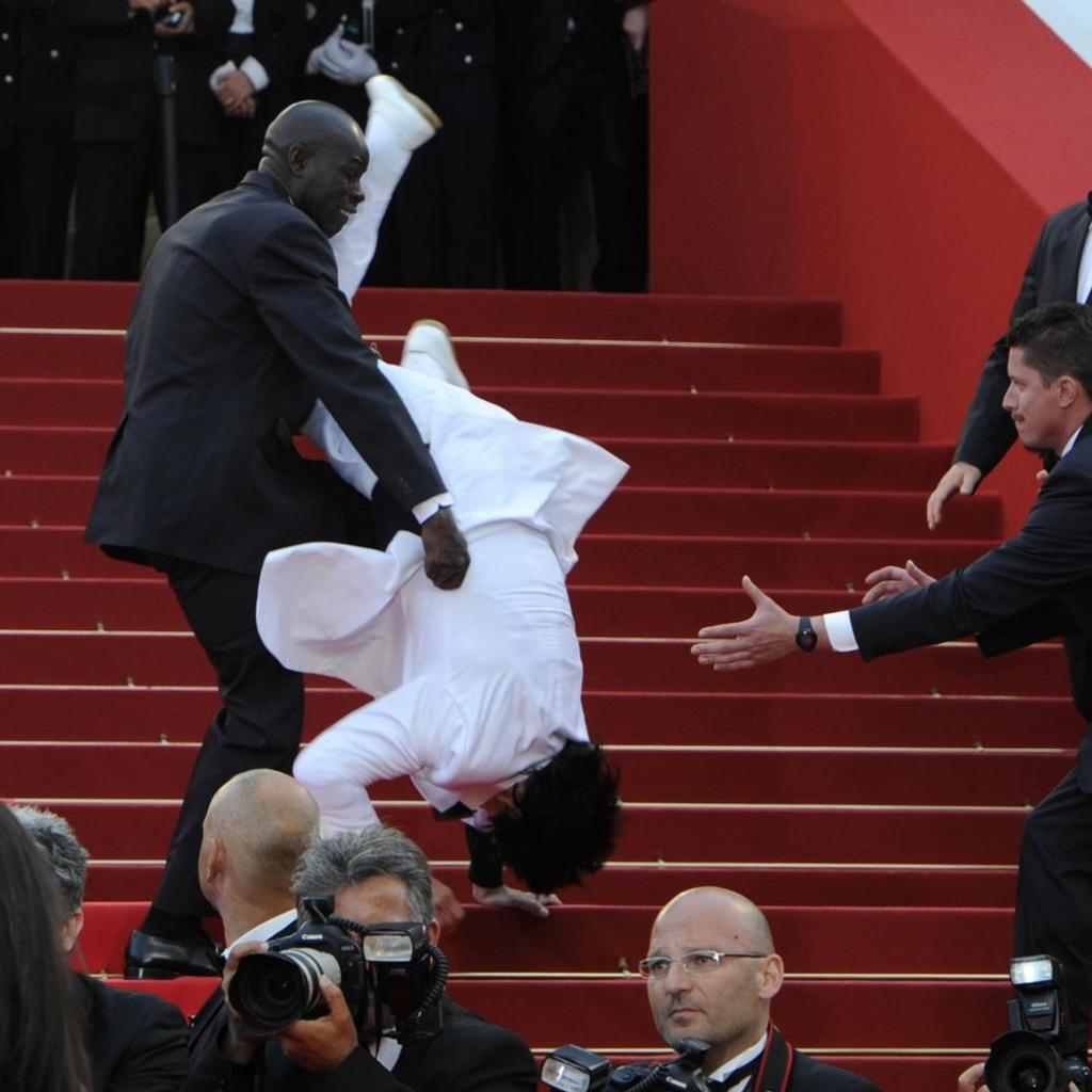Man performing stunt on red carpet