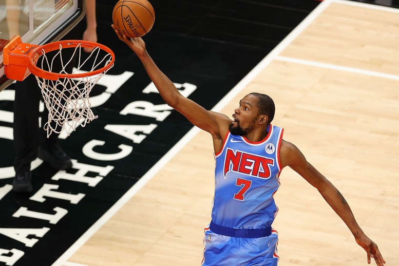 Tracy McGrady of the Orlando Magic goes up for the dunk as Andre News  Photo - Getty Images